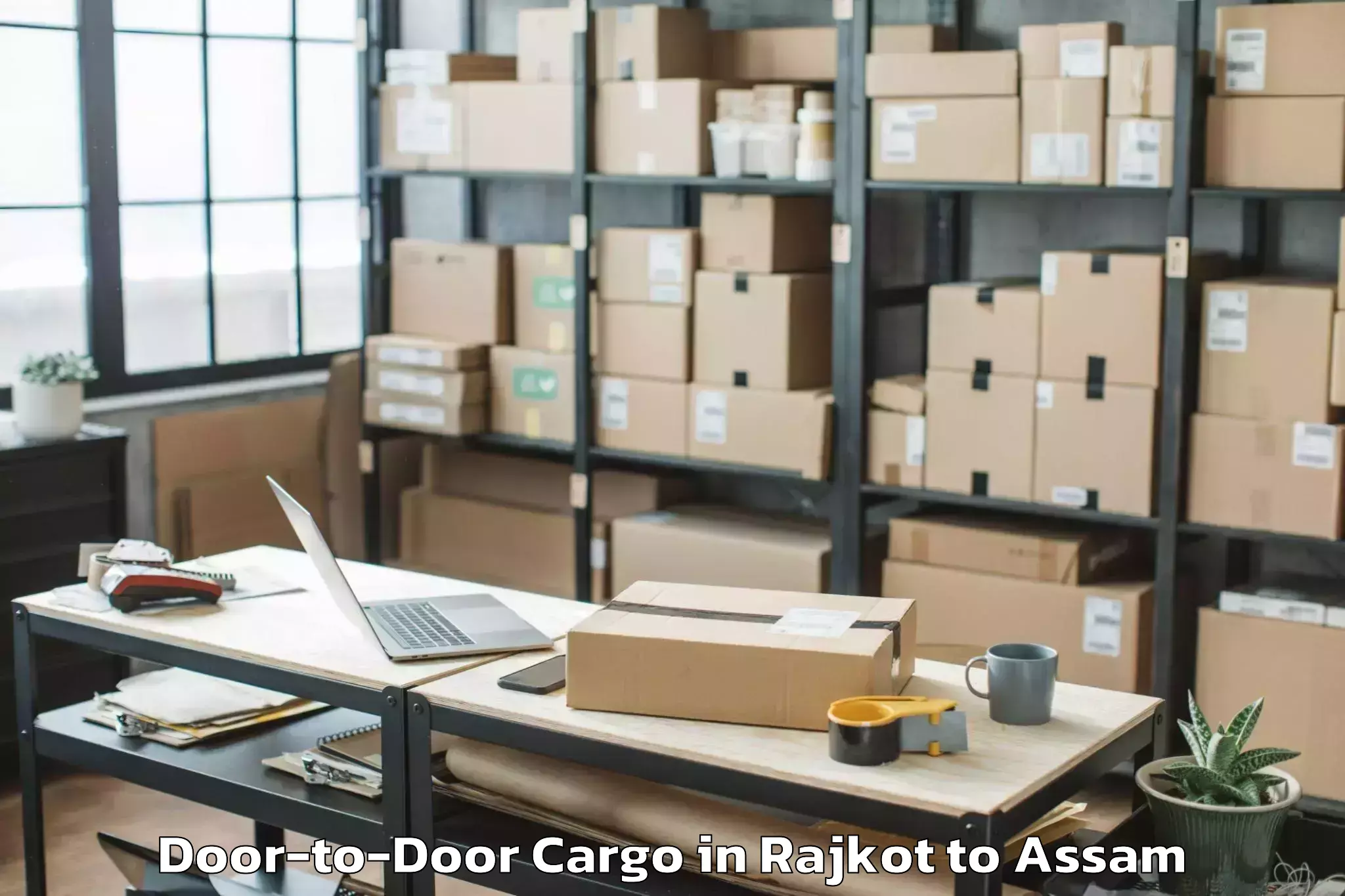 Quality Rajkot to Dhakuakhana Door To Door Cargo